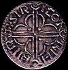 The back of a Viking coin showing the cross design for cutting.