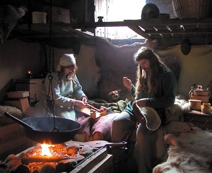 Working inside a Viking house. The Vikings were great craftsmen and examples of Viking crafts still survive from many sites.